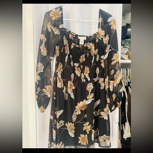 Black and orange printed dress. Long sleeve sheer